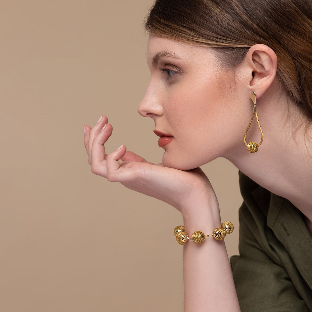 Drop earrings with Golden Grass globe pendant